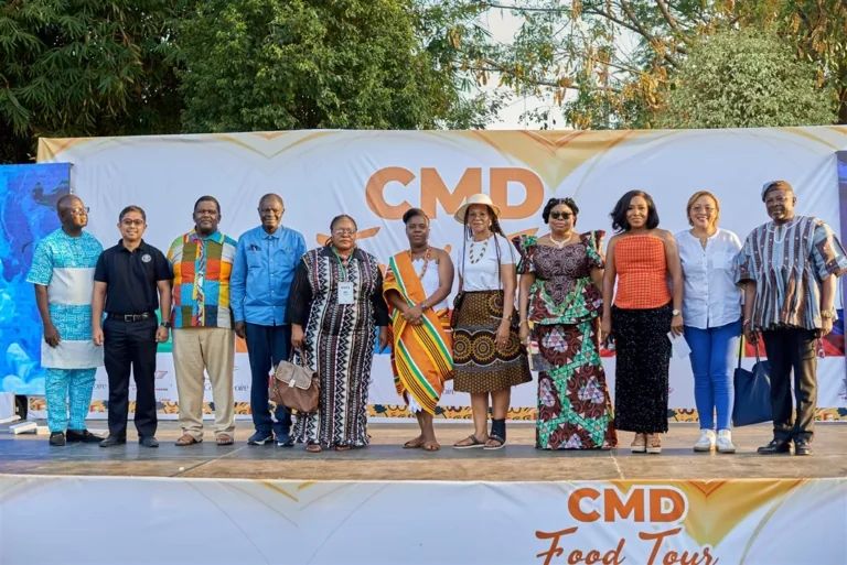 CMDFOODTOUR group photograph under the event banner