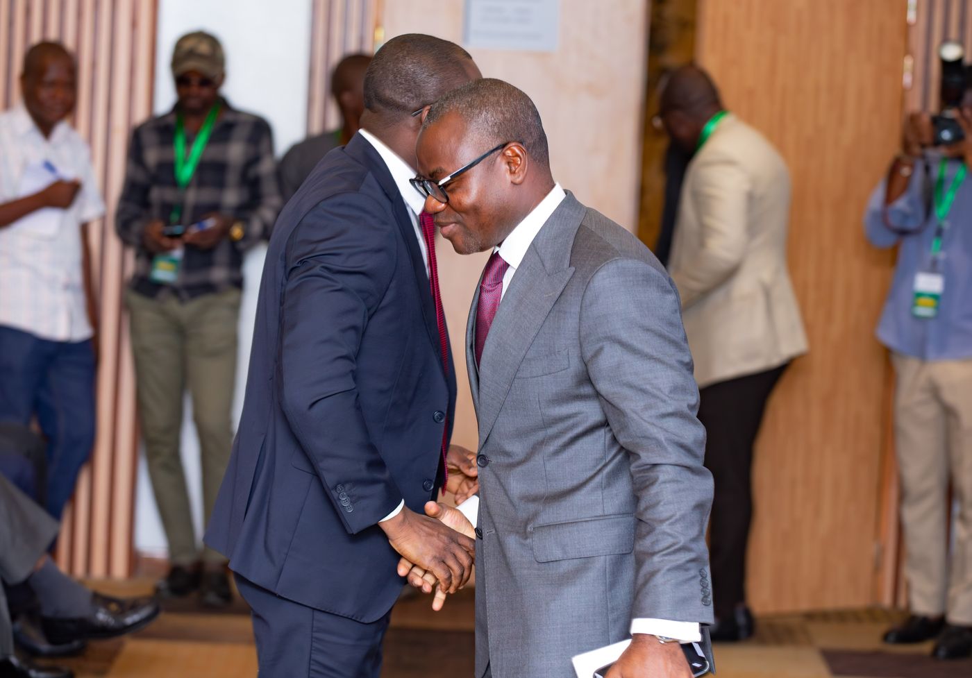 Two delegates greeting one another at Benin Deal Room 2026